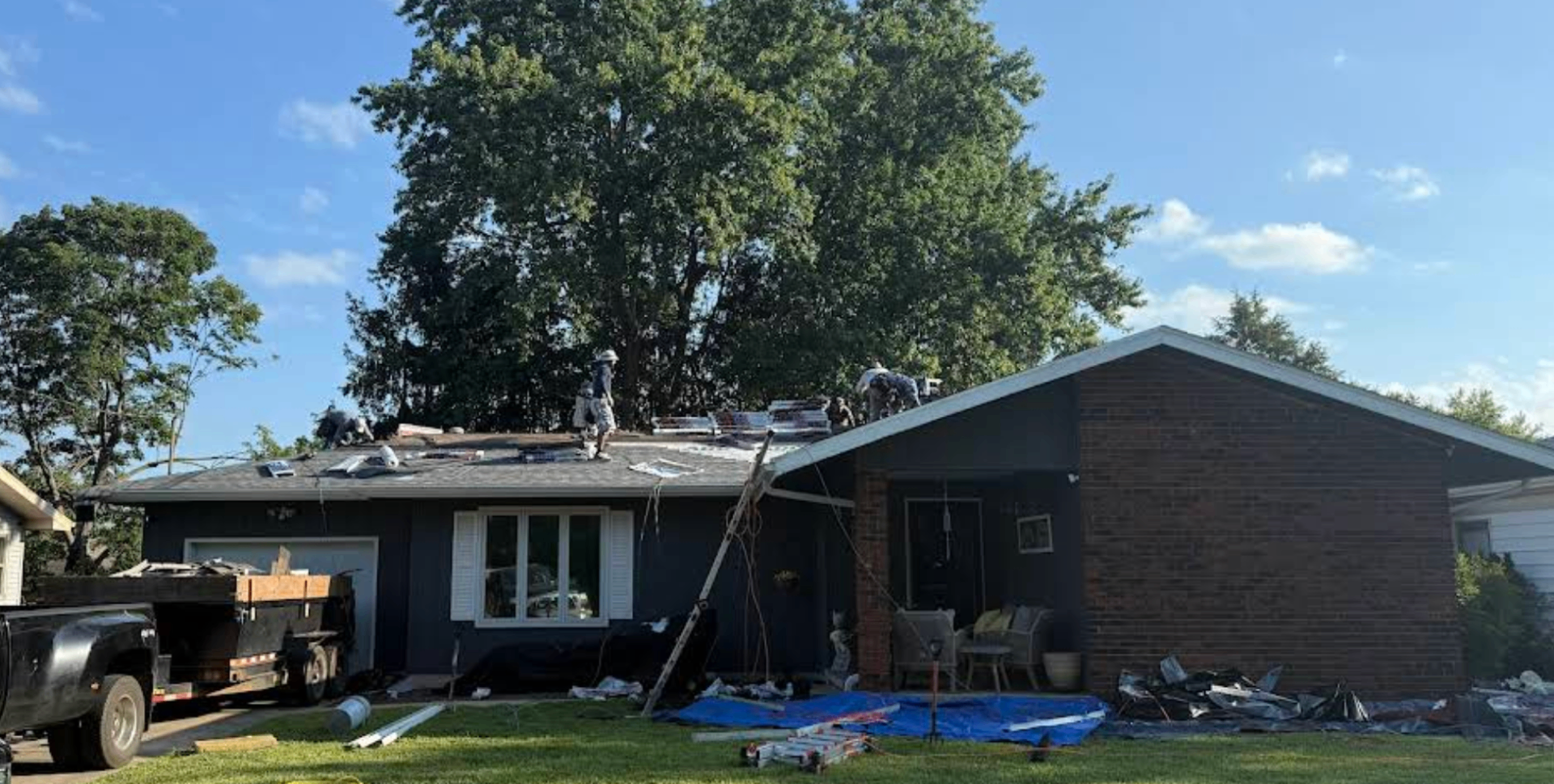 Sentinel crew actively installing a new roof